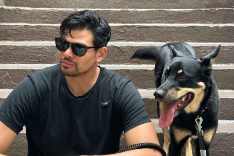 Mark Aquino with his dog sitting on stairs- Why I Coach